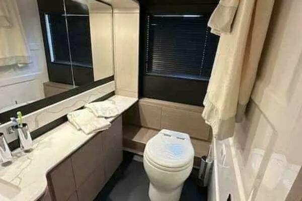  Yacht Photos Pics Luxurious bathroom in 2020 Azimut 66 yacht with modern fixtures and elegant design.