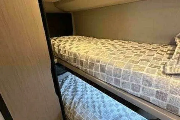  Yacht Photos Pics Bunk beds in 2020 Azimut 66 yacht cabin with patterned bedding.
