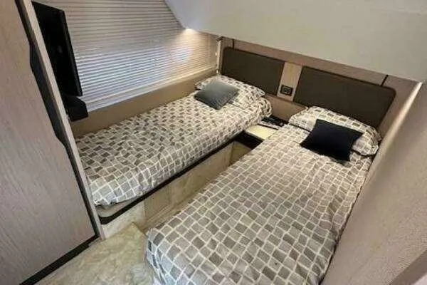  Yacht Photos Pics Interior of 2020 Azimut 66 yacht with twin beds and modern decor.