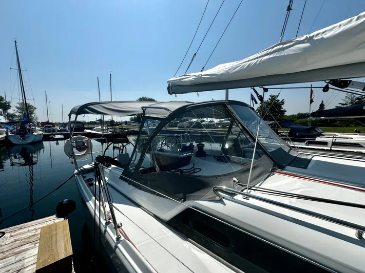  Yacht Photos Pics 2023 Beneteau Oceanis 34.1 sailboat docked at marina under clear blue sky.