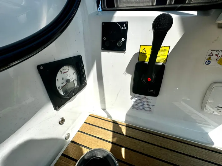  Yacht Photos Pics Control panel of 2023 Beneteau Oceanis 34.1 sailboat with throttle and gauge.