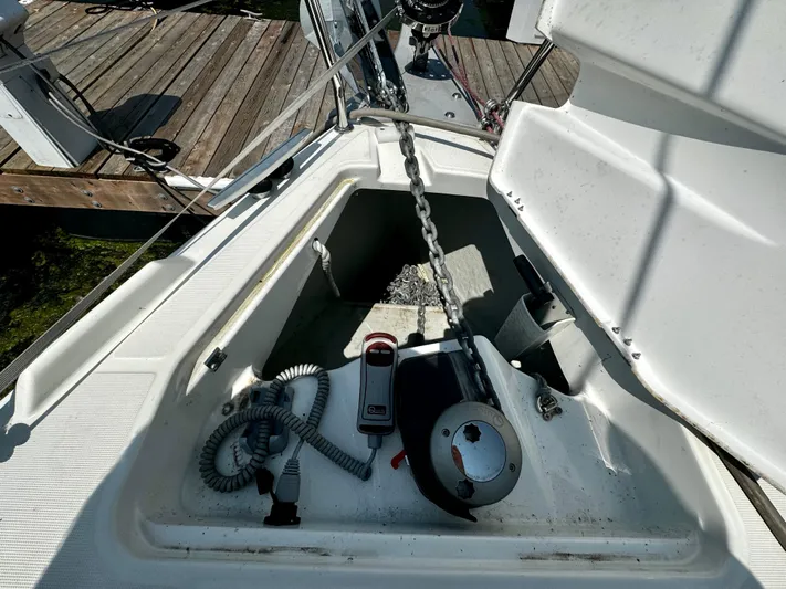  Yacht Photos Pics Anchor locker of 2023 Beneteau Oceanis 34.1 sailboat with chain and winch.
