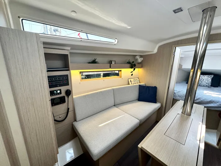  Yacht Photos Pics 2023 Beneteau Oceanis 34.1 interior with modern seating and cozy cabin.