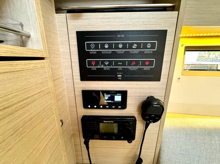  Yacht Photos Pics Control panel inside 2023 Beneteau Oceanis 34.1 yacht, featuring navigation and communication systems.