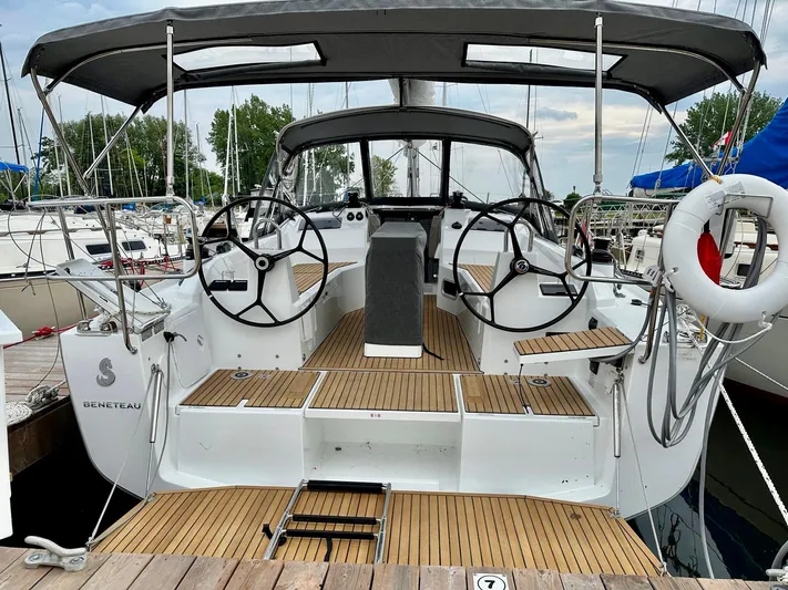  Yacht Photos Pics 2023 Beneteau Oceanis 34.1 sailboat with dual steering wheels and teak deck.