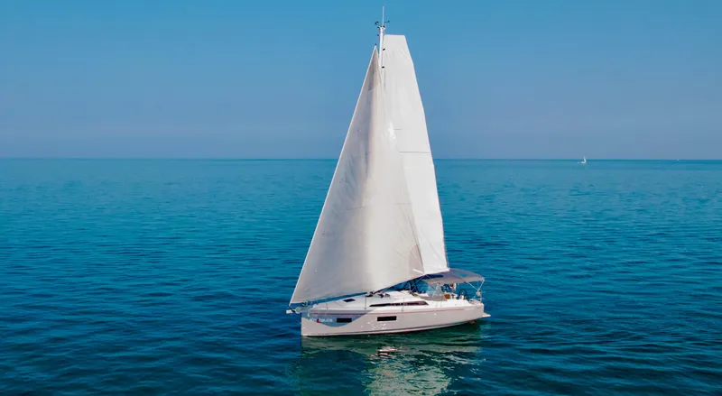  Yacht Photos Pics 2023 Beneteau Oceanis 34.1 sailing on calm blue waters.