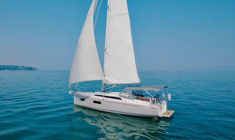  Yacht Photos Pics 2023 Beneteau Oceanis 34.1 sailing on calm blue waters.