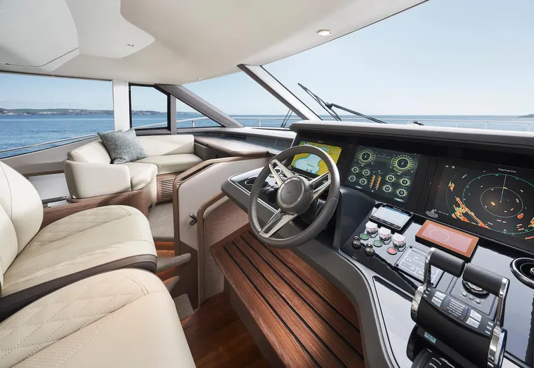  Yacht Photos Pics Luxurious 2025 Princess Y72 Motor Yacht helm with advanced navigation systems and plush seating.