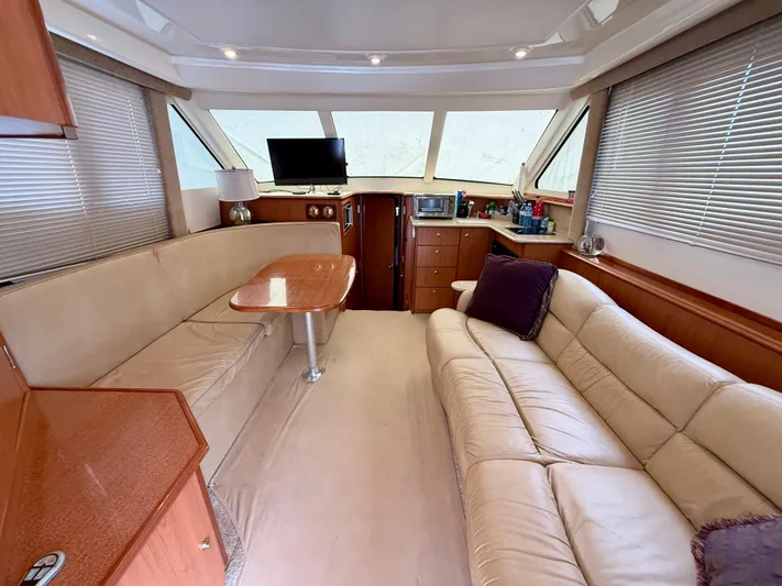  Yacht Photos Pics Interior of 2008 Silverton 33 Convertible yacht with beige seating and modern amenities.