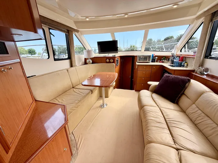  Yacht Photos Pics Luxurious interior of a 2008 Silverton 33 Convertible yacht with plush seating and modern amenities.