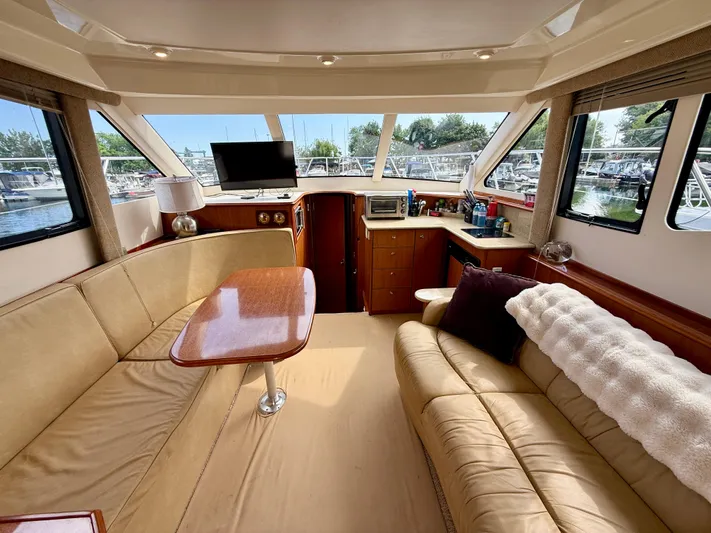  Yacht Photos Pics Interior of 2008 Silverton 33 Convertible yacht with cozy seating and modern amenities.