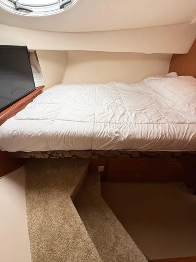  Yacht Photos Pics Interior cabin of 2008 Silverton 33 Convertible with bed and carpeted steps.