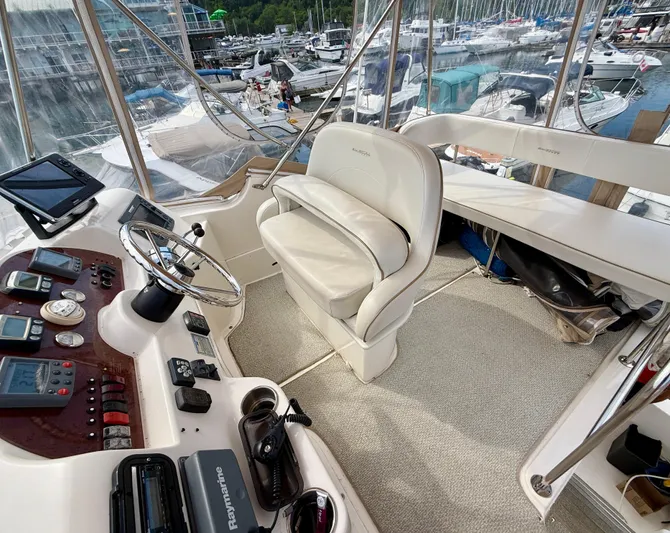  Yacht Photos Pics 2008 Silverton 33 Convertible yacht helm with modern navigation equipment and marina view.