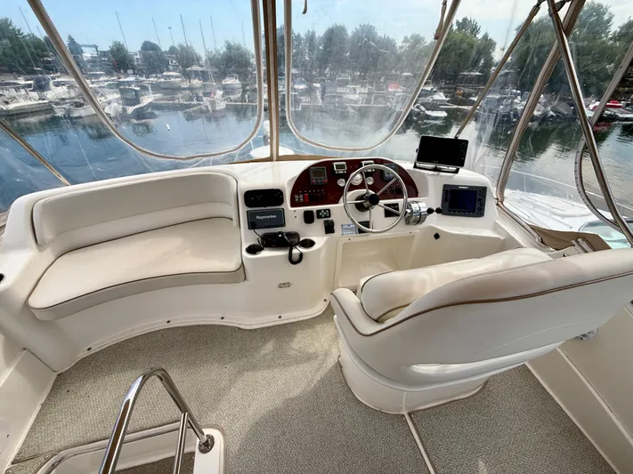  Yacht Photos Pics 2008 Silverton 33 Convertible yacht helm with modern controls and marina view.