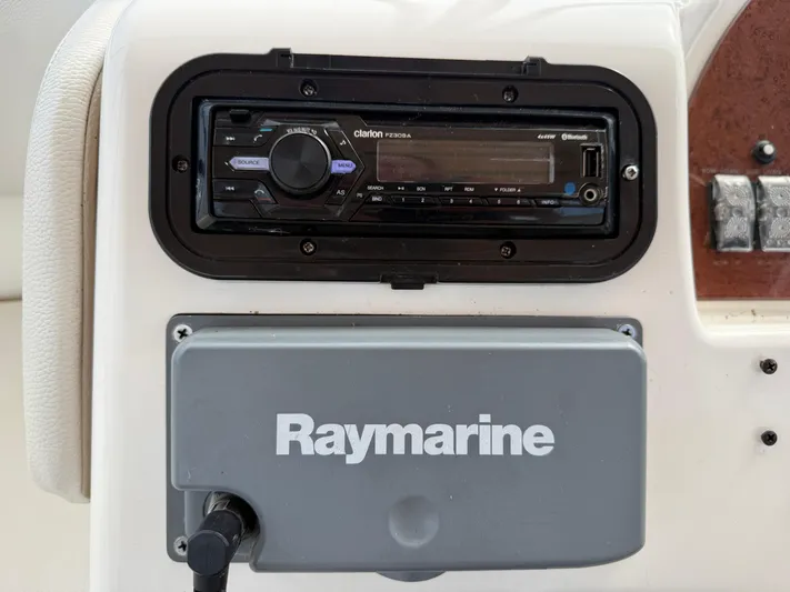  Yacht Photos Pics Clarion stereo and Raymarine device on 2008 Silverton 33 Convertible boat dashboard.