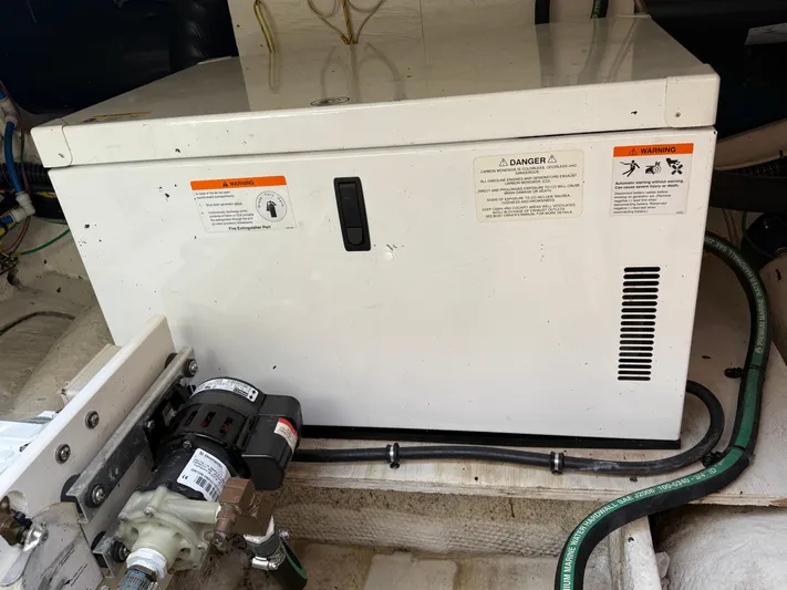  Yacht Photos Pics Engine compartment of a 2008 Silverton 33 Convertible boat with equipment and warning labels.