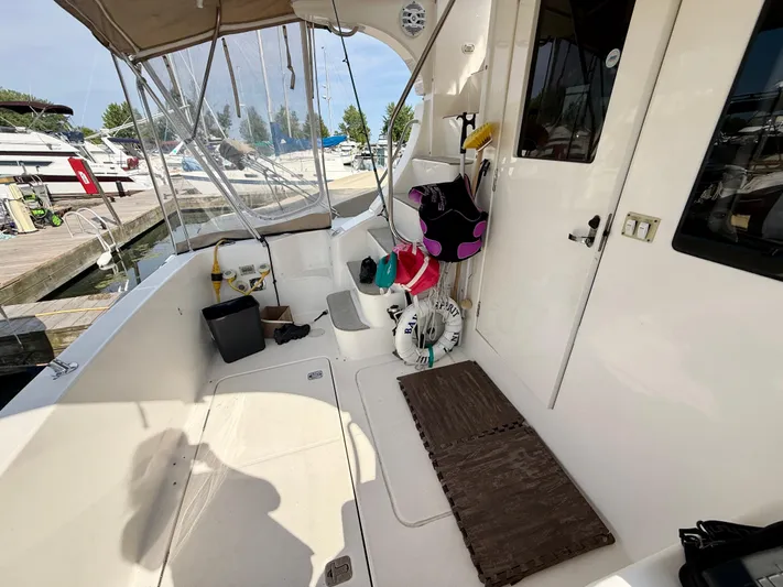  Yacht Photos Pics 2008 Silverton 33 Convertible boat interior with dock view and safety equipment.