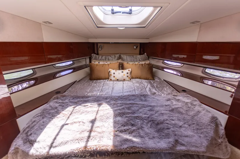  Yacht Photos Pics Luxurious cabin interior of 2011 Sea Ray 450 Sundancer yacht with plush bedding.