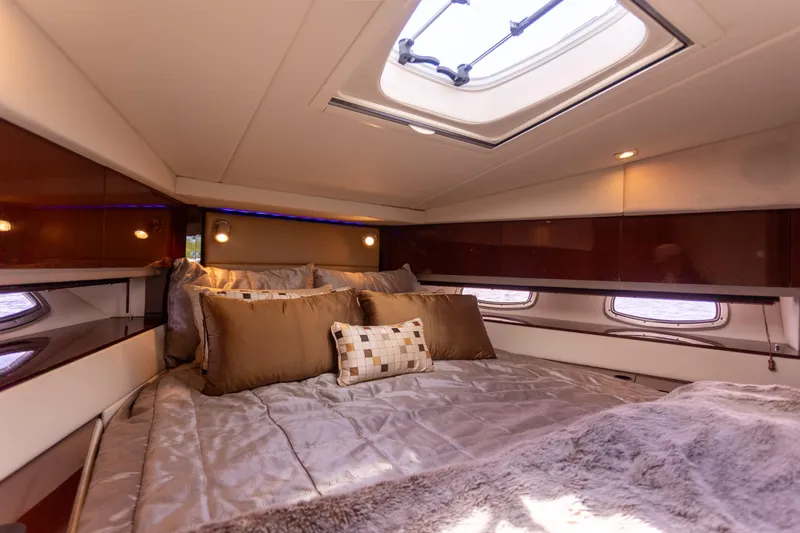  Yacht Photos Pics Luxurious cabin interior of 2011 Sea Ray 450 Sundancer yacht with plush bedding.