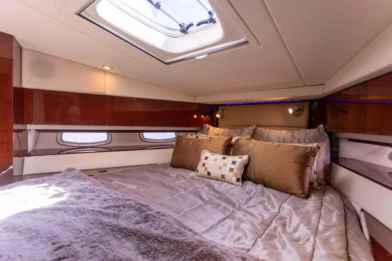  Yacht Photos Pics Luxurious cabin interior of 2011 Sea Ray 450 Sundancer yacht with plush bedding.