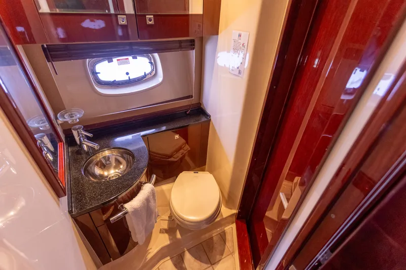  Yacht Photos Pics Luxurious bathroom in 2011 Sea Ray 450 Sundancer yacht with sink and toilet.