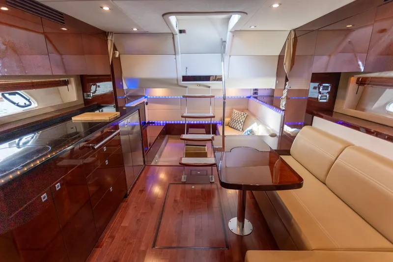  Yacht Photos Pics Luxurious interior of 2011 Sea Ray 450 Sundancer yacht with elegant wood finishes.
