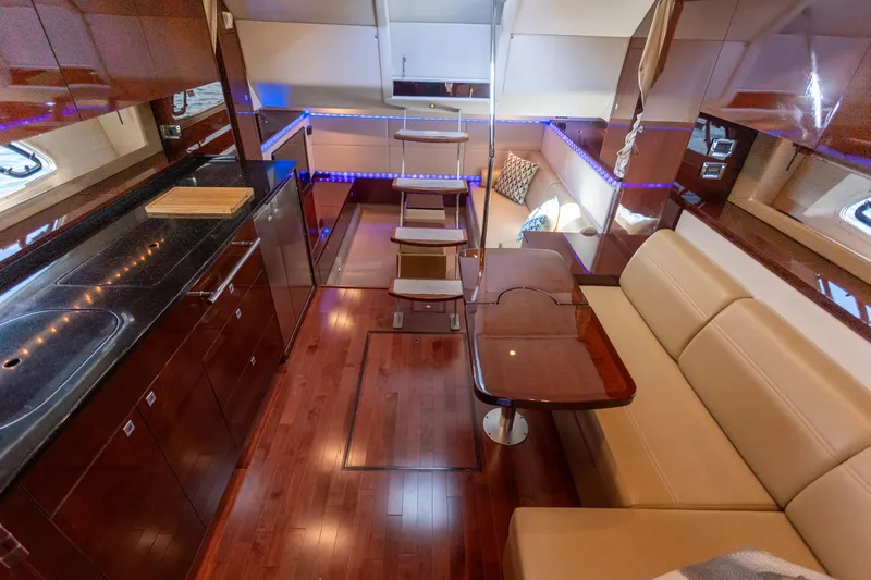  Yacht Photos Pics Luxurious interior of 2011 Sea Ray 450 Sundancer yacht with elegant wood finishes.