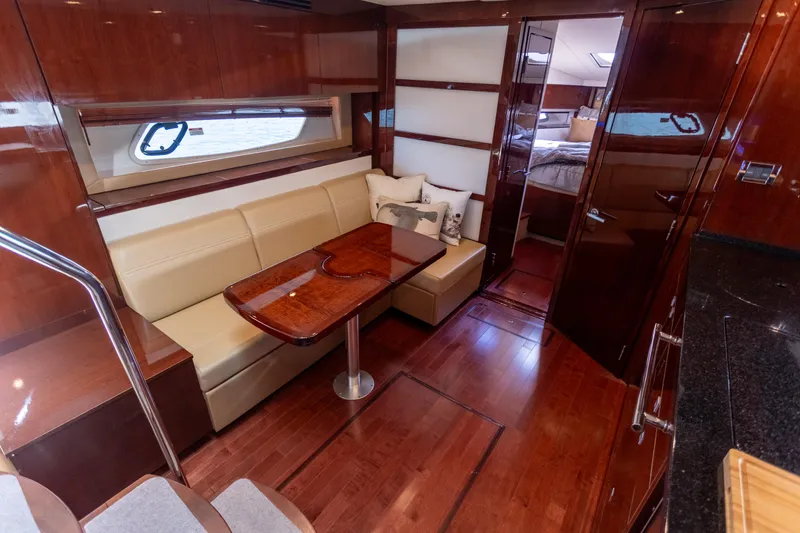  Yacht Photos Pics Luxurious interior of 2011 Sea Ray 450 Sundancer yacht with elegant wood finishes.