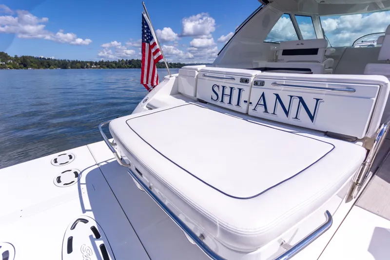  Yacht Photos Pics 2011 Sea Ray 450 Sundancer yacht with American flag on a sunny day.