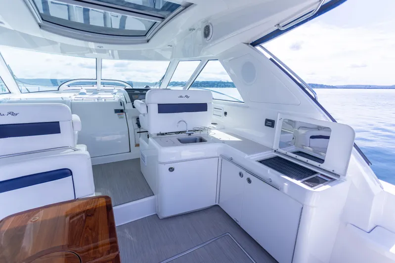  Yacht Photos Pics Interior of 2011 Sea Ray 450 Sundancer yacht with modern seating and kitchenette.