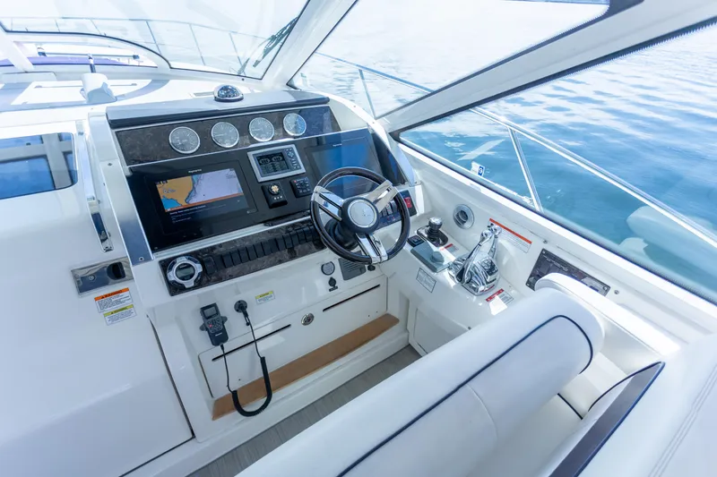  Yacht Photos Pics Helm of 2011 Sea Ray 450 Sundancer yacht with modern navigation equipment.