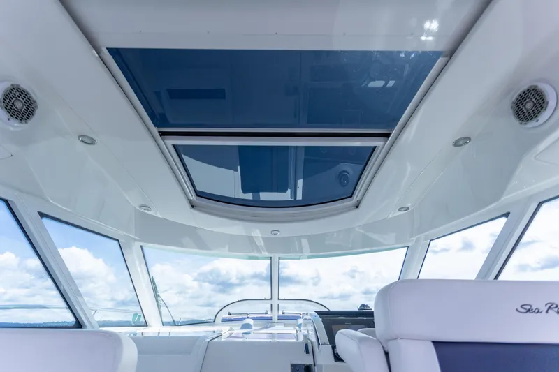  Yacht Photos Pics Interior view of 2011 Sea Ray 450 Sundancer yacht with panoramic windows and sleek design.