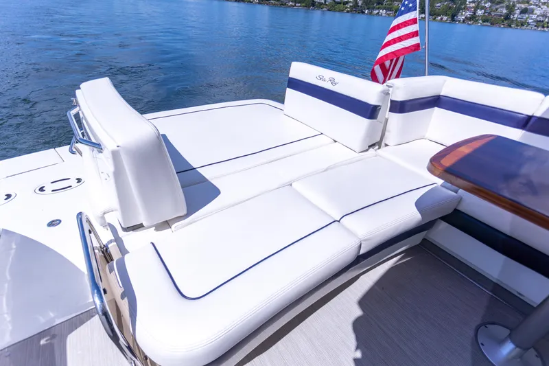 Yacht Photos Pics Luxurious 2011 Sea Ray 450 Sundancer yacht with spacious deck seating and American flag.