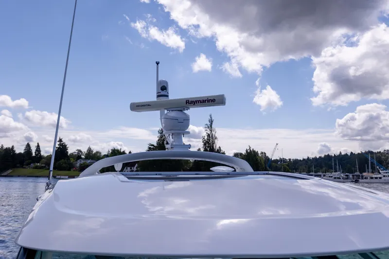  Yacht Photos Pics 2011 Sea Ray 450 Sundancer yacht with Raymarine radar, under a partly cloudy sky.