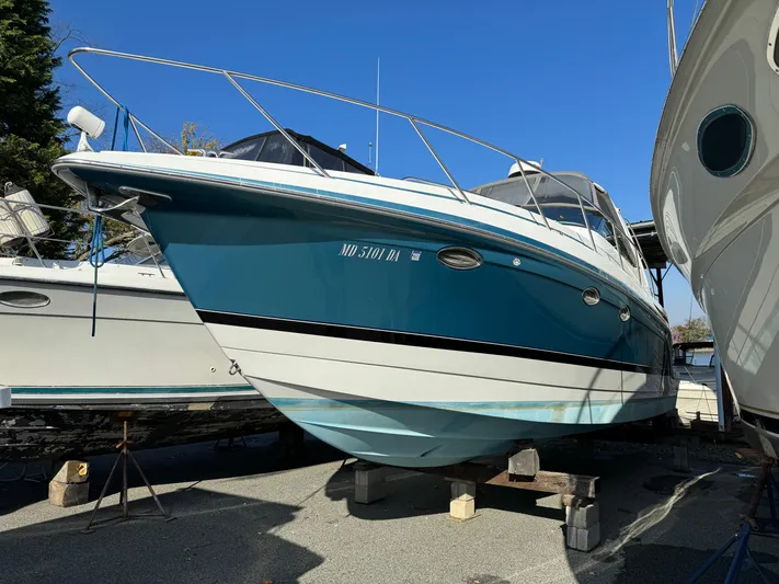  Yacht Photos Pics 2005 Formula 34 Performance Cruiser boat on dry dock, blue and white hull, sunny day.
