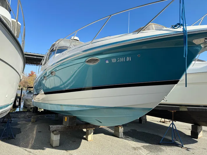  Yacht Photos Pics 2005 Formula 34 Performance Cruiser boat on stands, blue hull, docked outdoors.