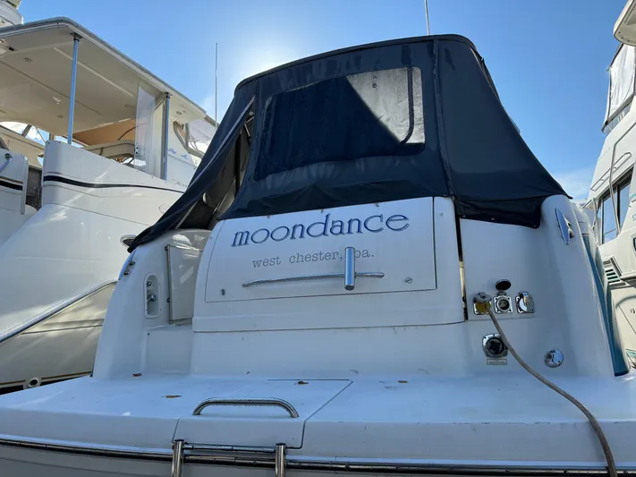  Yacht Photos Pics 2005 Formula 34 Performance Cruiser named "Moondance" docked under clear blue sky.