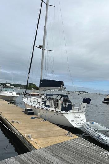 1986 Pearson 33-2 sailboat docked at a marina, overcast sky.