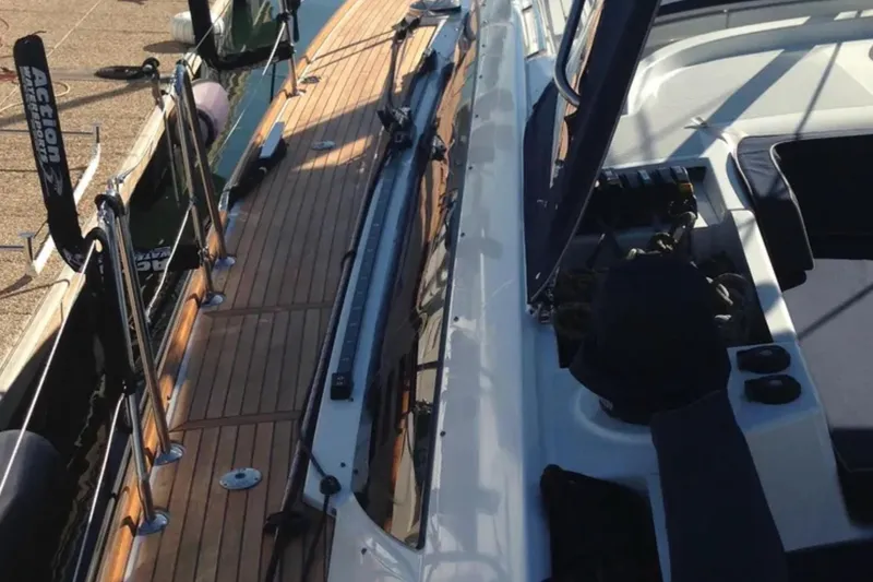 Tenacity Yacht Photos Pics 2011 Jeanneau 57 sailboat deck with wooden finish and sleek design.
