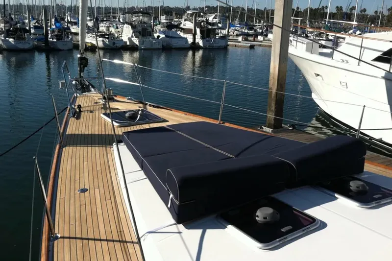 Tenacity Yacht Photos Pics 2011 Jeanneau 57 yacht docked in marina, showcasing sleek deck design.