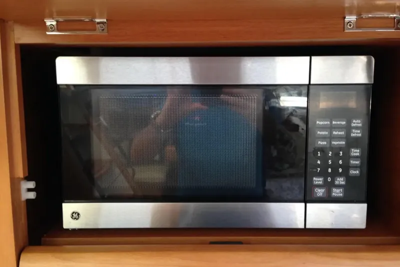 Tenacity Yacht Photos Pics Built-in GE microwave in 2011 Jeanneau 57 yacht kitchen.