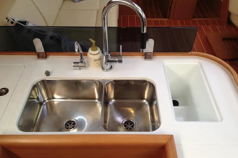 Tenacity Yacht Photos Pics Luxury Jeanneau 57 yacht kitchen sink with dual basins, faucet, and soap dispenser, 2011 model.