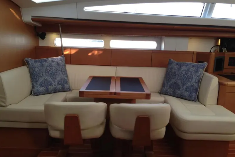 Tenacity Yacht Photos Pics Luxurious interior of 2011 Jeanneau 57 yacht with elegant seating and cushions.