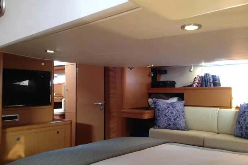 Tenacity Yacht Photos Pics Luxurious interior of 2011 Jeanneau 57 yacht with cozy seating and modern amenities.