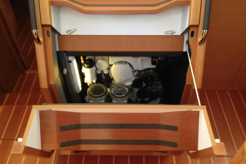 Tenacity Yacht Photos Pics Interior view of a 2011 Jeanneau 57 yacht's engine compartment, showcasing mechanical components.