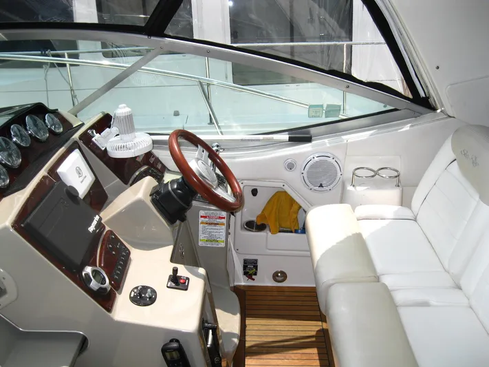  Yacht Photos Pics 2011 Sea Ray 350 Sundancer helm with leather seating and wooden accents.