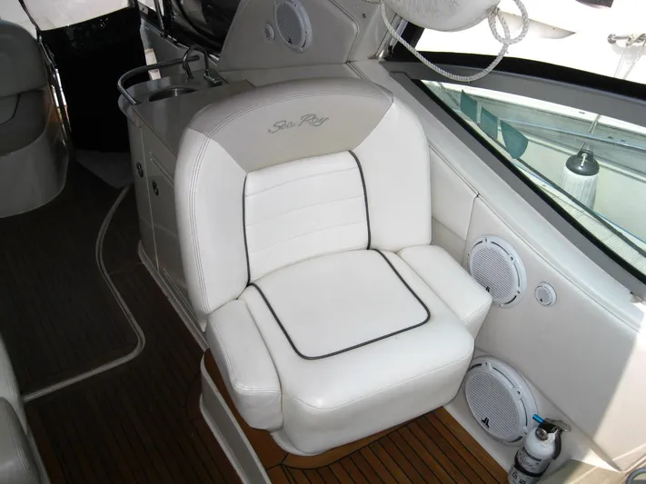  Yacht Photos Pics Luxury seating on 2011 Sea Ray 350 Sundancer yacht, featuring white upholstery and wood flooring.