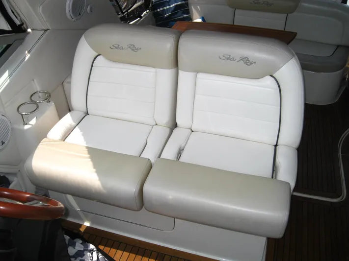  Yacht Photos Pics 2011 Sea Ray 350 Sundancer interior with white leather seating and wooden flooring.