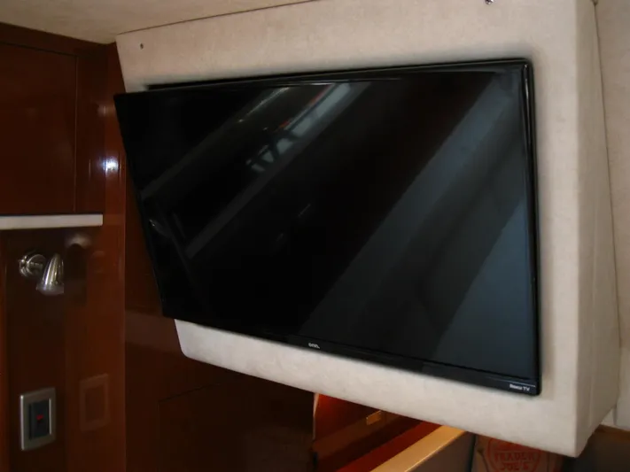  Yacht Photos Pics Flat-screen TV mounted inside 2011 Sea Ray 350 Sundancer yacht interior.