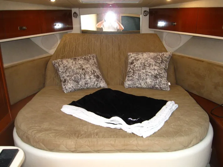  Yacht Photos Pics Interior cabin of 2011 Sea Ray 350 Sundancer with cozy bed and pillows.
